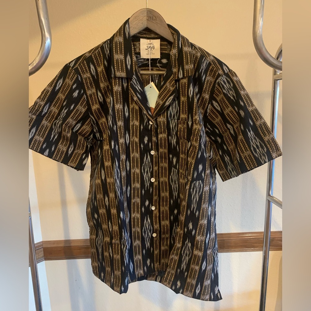 Shirt, size medium, light material.